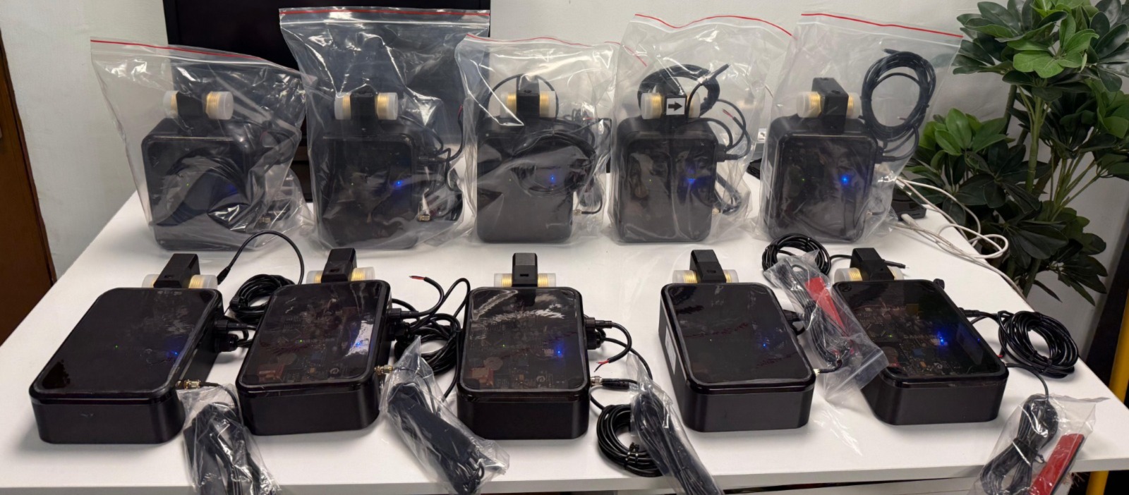A production batch of assembled OASISLink dMRV units, ready to ship
